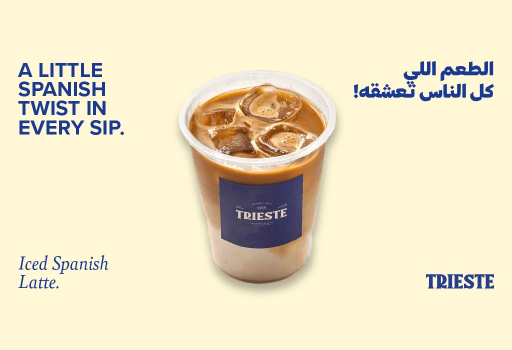 Trieste iced Spanish latte in a branded takeaway cup